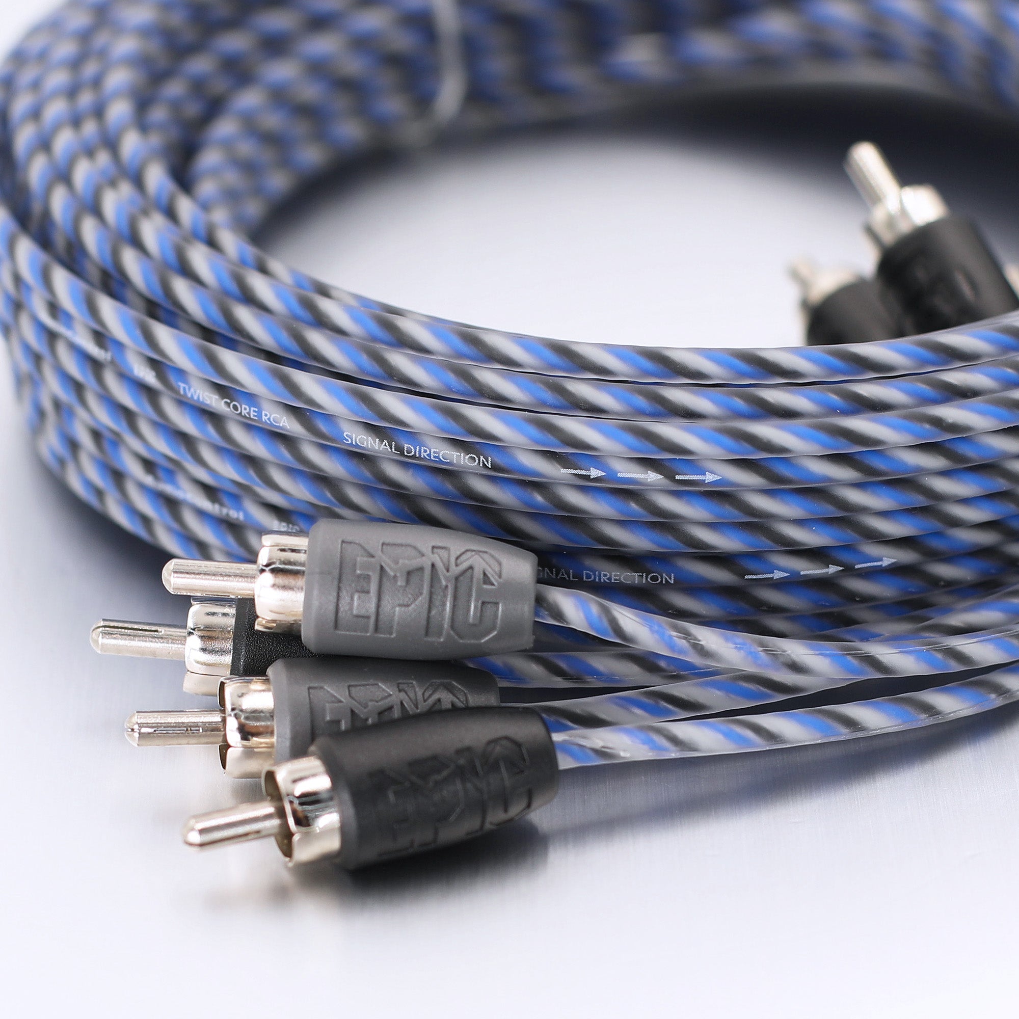 A coiled audio cable with a blue and gray striped braided jacket, featuring silver RCA connectors with black and gray protective boots. The brand name 'EPIC' is embossed on the gray connector housings.