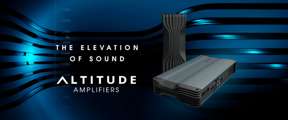 Altitude Amplifiers sound system product shown against a dark blue abstract background with glowing wave lines and the text 'THE ELEVATION OF SOUND ALTITUDE AMPLIFIERS'. The image features two electronic devices: a silver and black rectangular amplifier in the foreground and a tall, ribbed black tower unit behind it.