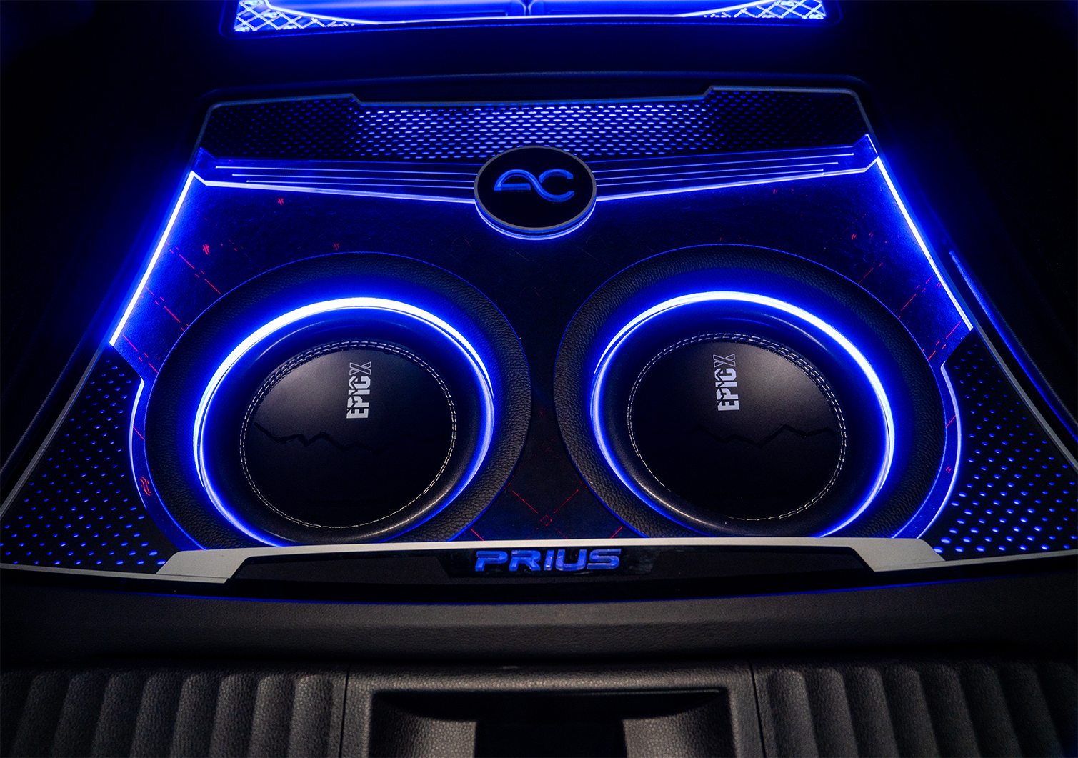 Car audio system with blue lighting and 'EPIC' branding on a dark background