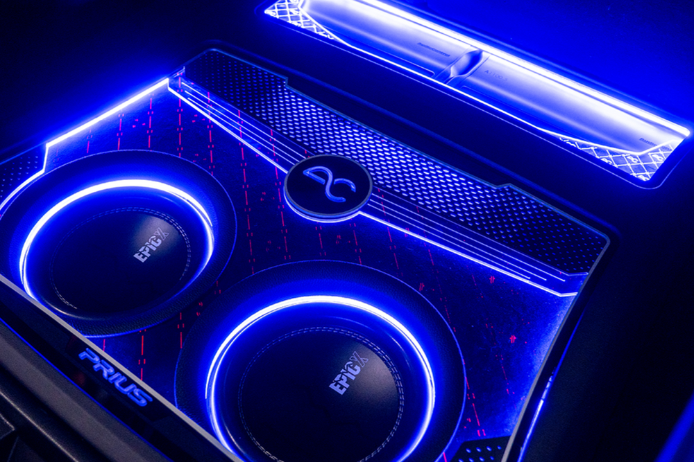 Car subwoofer with blue LED lighting and a visible brand EPICX logo.